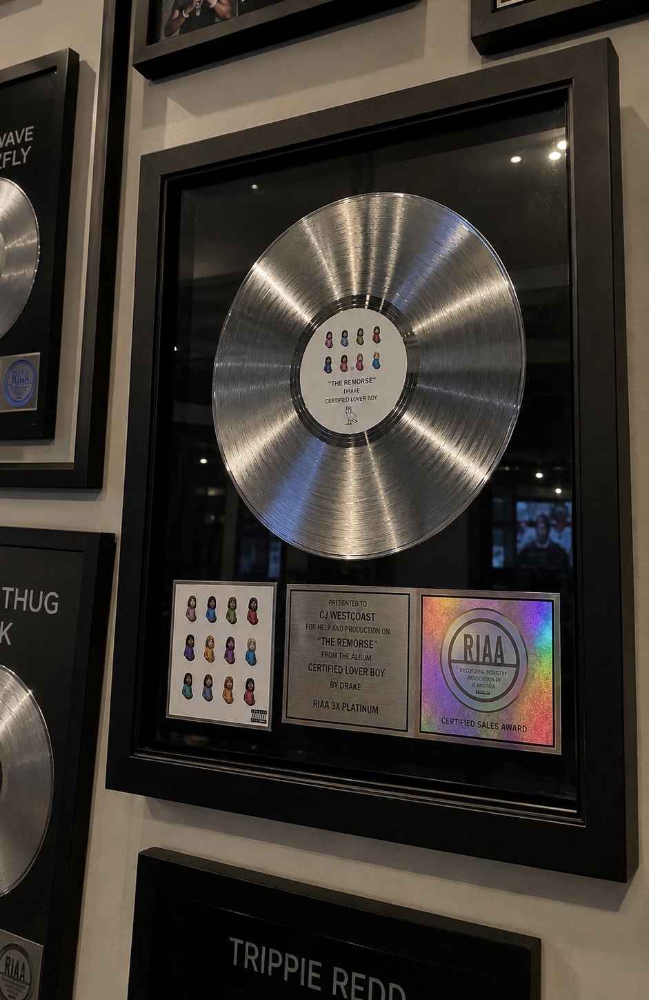 Platinum record plaque presented to CJ WestCoast for production work